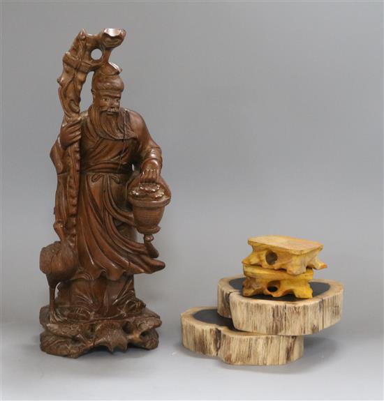 A Chinese early 20th century figural carving and two pairs of stands H.32cm